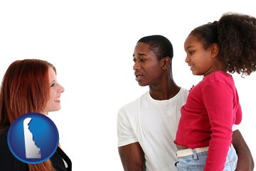 a social worker conversing with clients - with Delaware icon